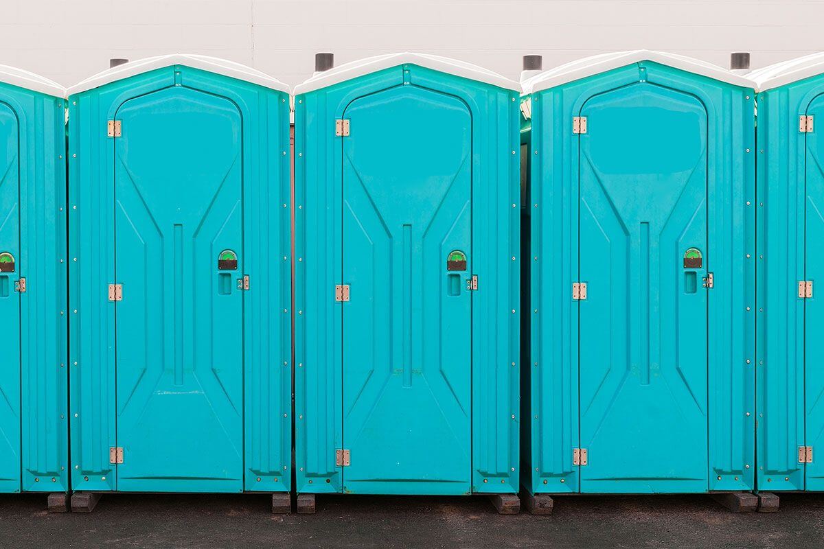 Industrial portable restroom units at a plant in Fresno, California
